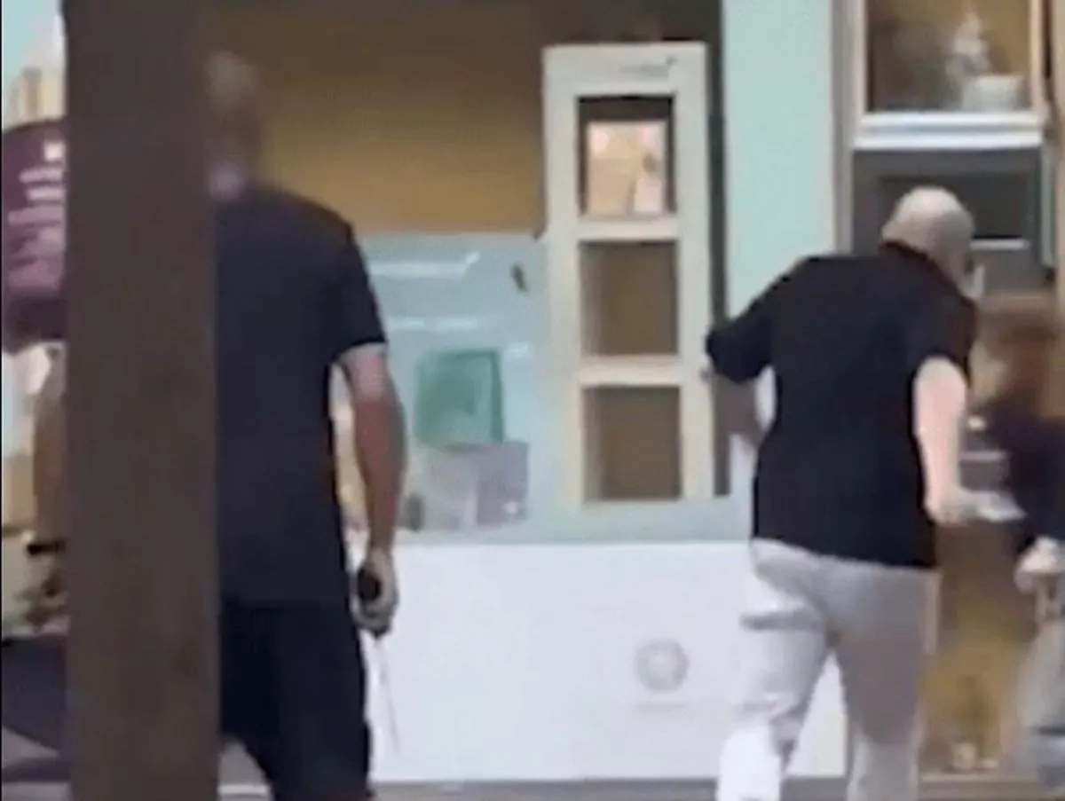 Horror moment man with huge knife runs through Barcelona streets as tourists flee