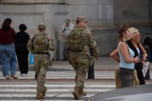 Pentagon says some National Guard units in Washington now carrying firearms as Trump targets more cities