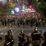 Antigovernment protesters clash with police in several Serbian cities