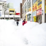Record-breaking snow blankets Japan, killing at least 30 people